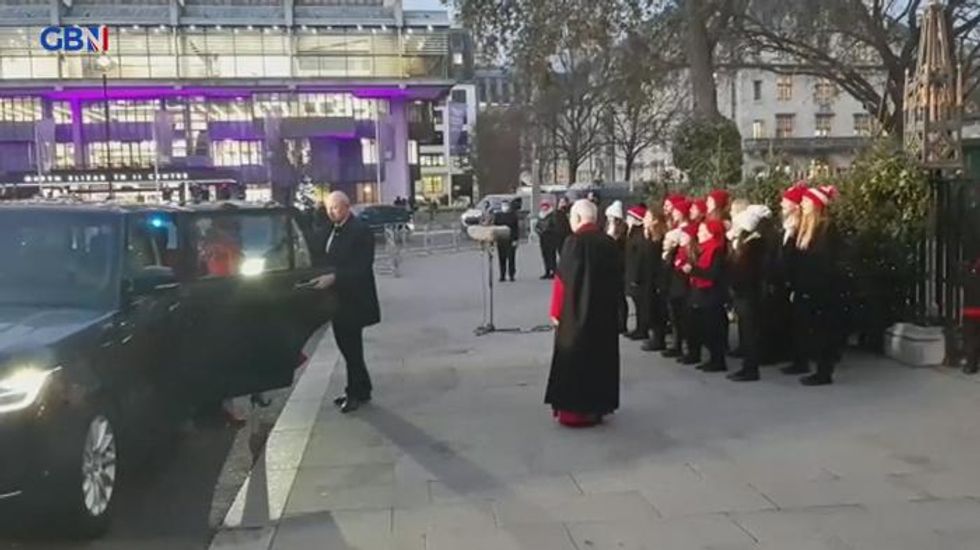 Kate Middleton appears in a festive frock as she hosts a Christmas carol concert