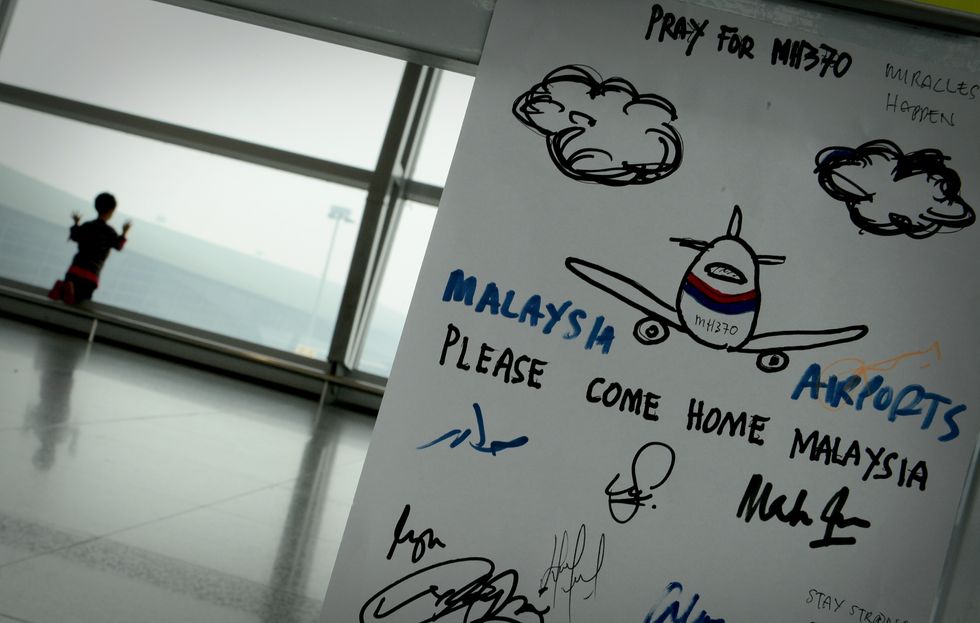 A boy waits for his family members to arrived at the KLIA on March,13, 2014