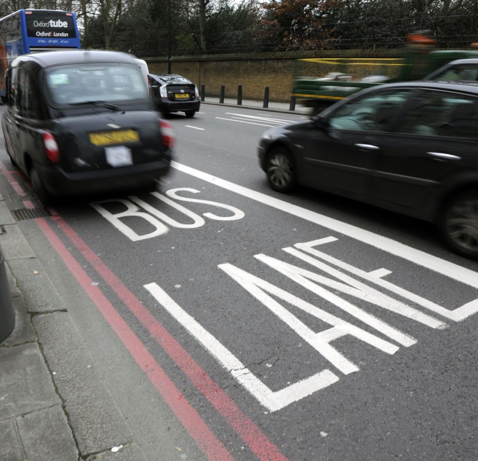 A bus lane with traffic in the background 