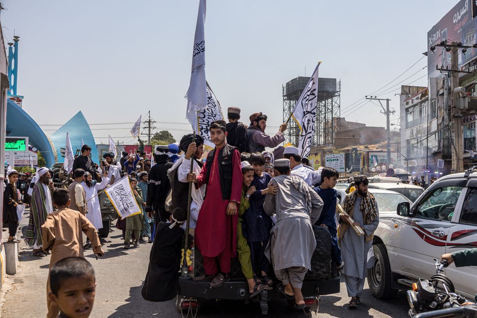 A convoy of Taliban security personnel is seen moving along the streets as they celebrate the third anniversary of the Taliban takeover of Afghanistan