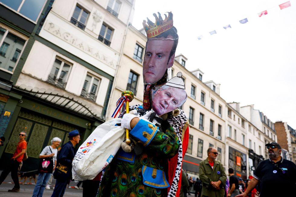 A cut-out depicting French President Emmanuel Macron and Prime Minister Michel Barnier is pictured during a demonstration