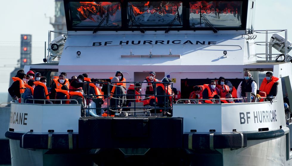 A group of people thought to be migrants are brought in to Dover, Kent, onboard a Border Force vessel , following a small boat incident in the Channel. Picture date: Friday October 8, 2021.