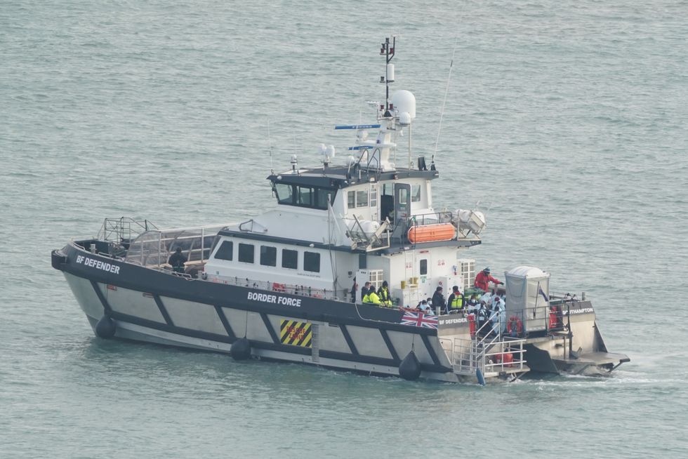 A group of people thought to be migrants are brought in to Dover, Kent