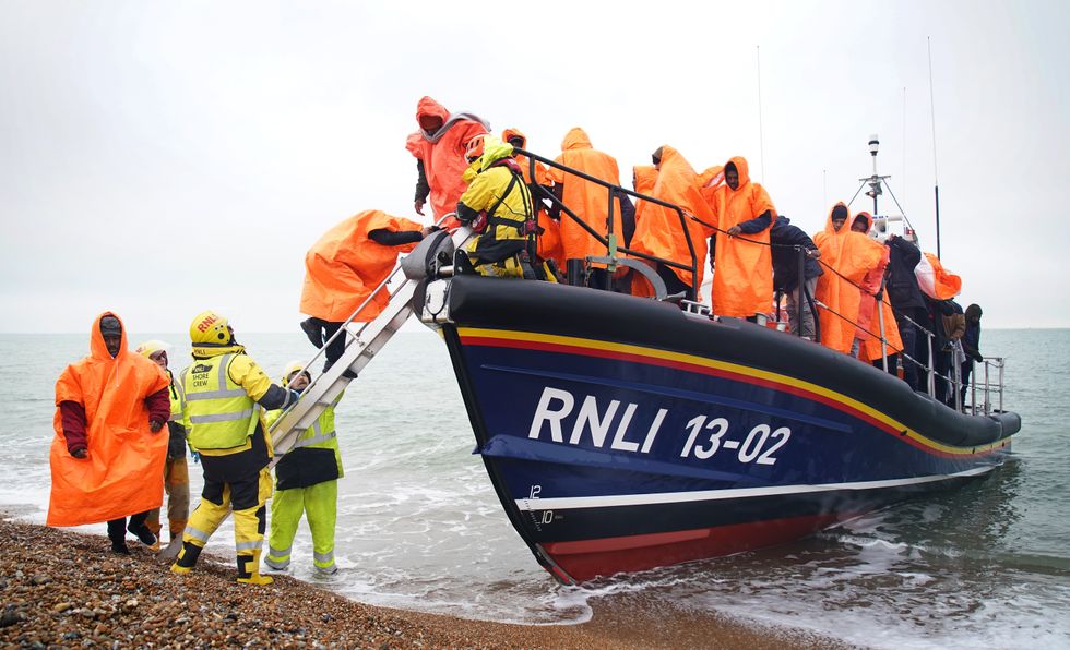 A group of people thought to be migrants are brought in to Dungeness, Kent