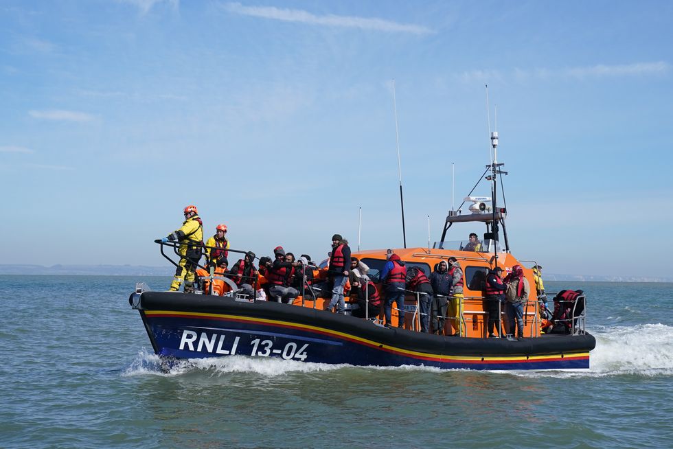 A group of people thought to be migrants are brought in to Dungeness, Kent