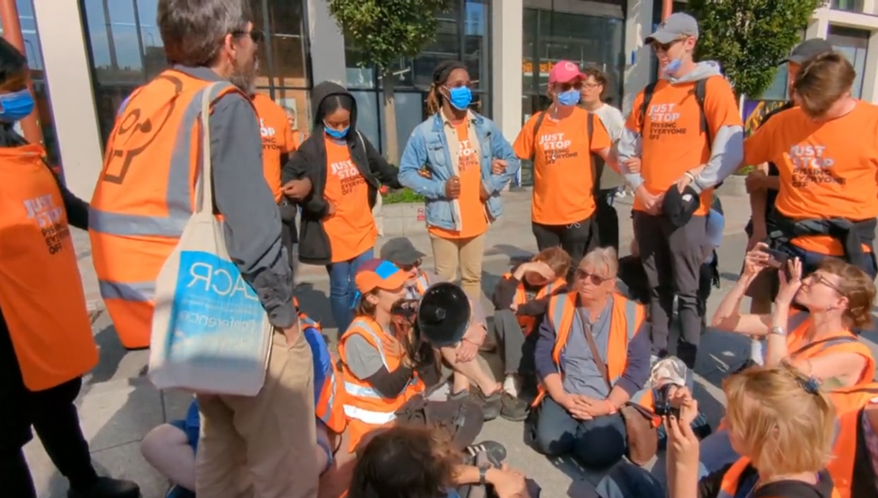 A Just Stop Oil activist used a megaphone to communicate with counter-protesters