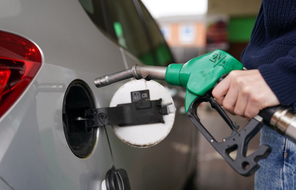 A man filling up his car with petrol