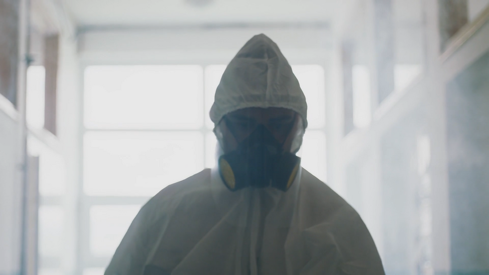 A man in a hazmat suit