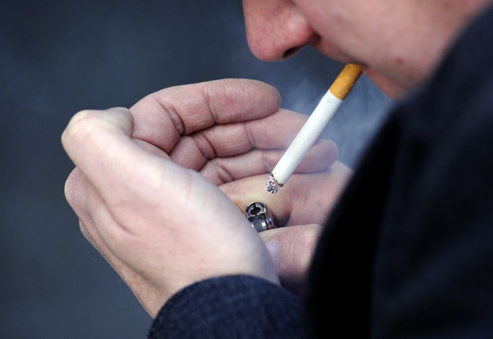 A man smoking a cigarette