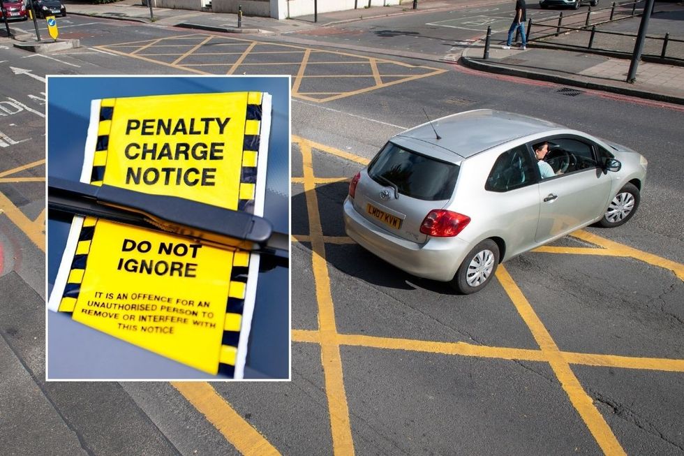 A penalty charge notice and a car driving inside a yellow box junction