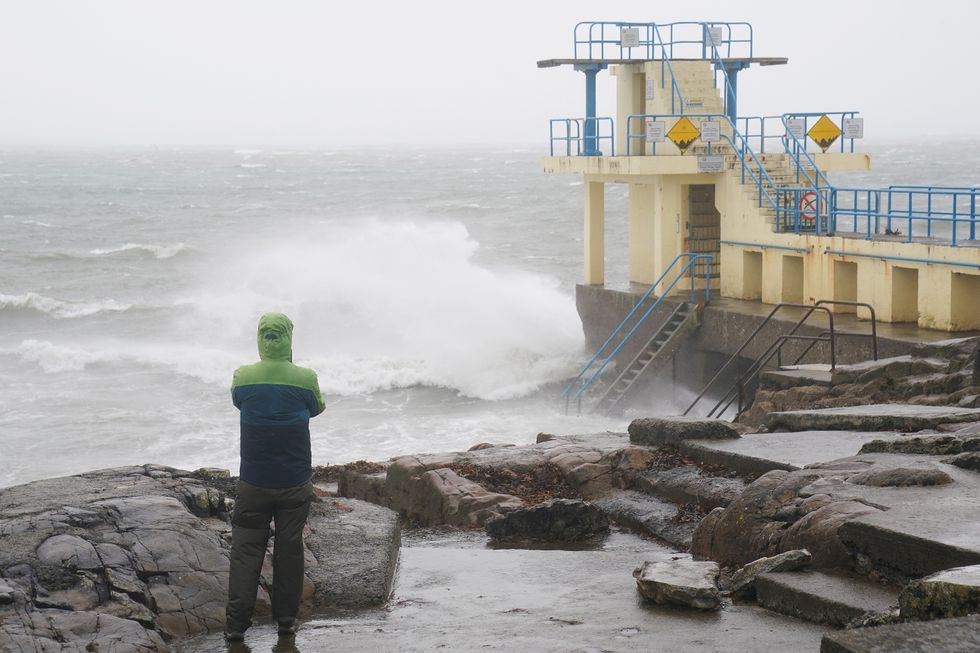 A person watches the waves at the Blackrock diving tower in Salthill, Galway,u200b