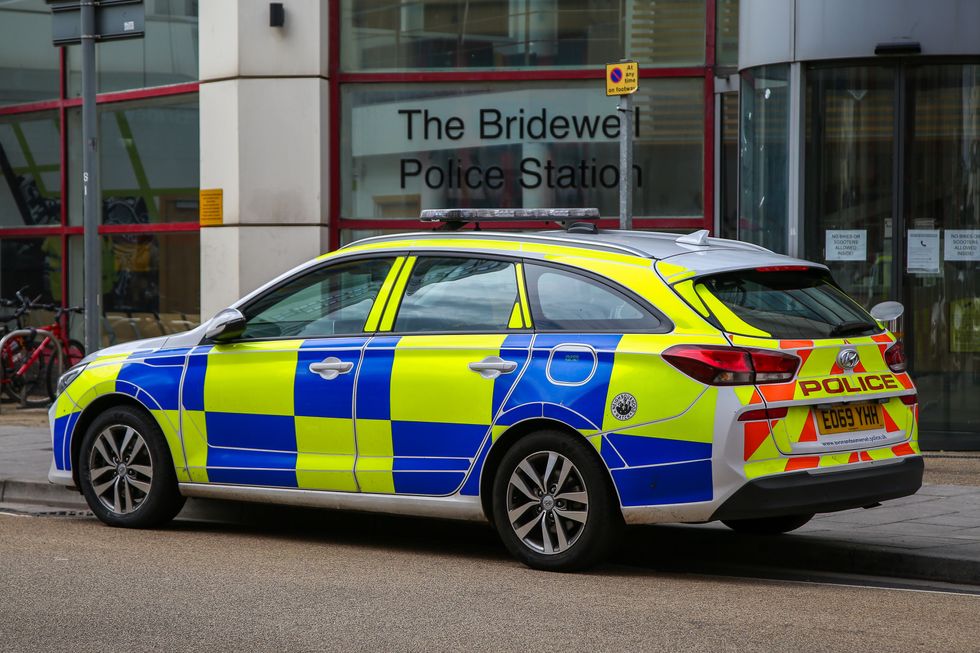 A police car parked outside a police station in Bristol