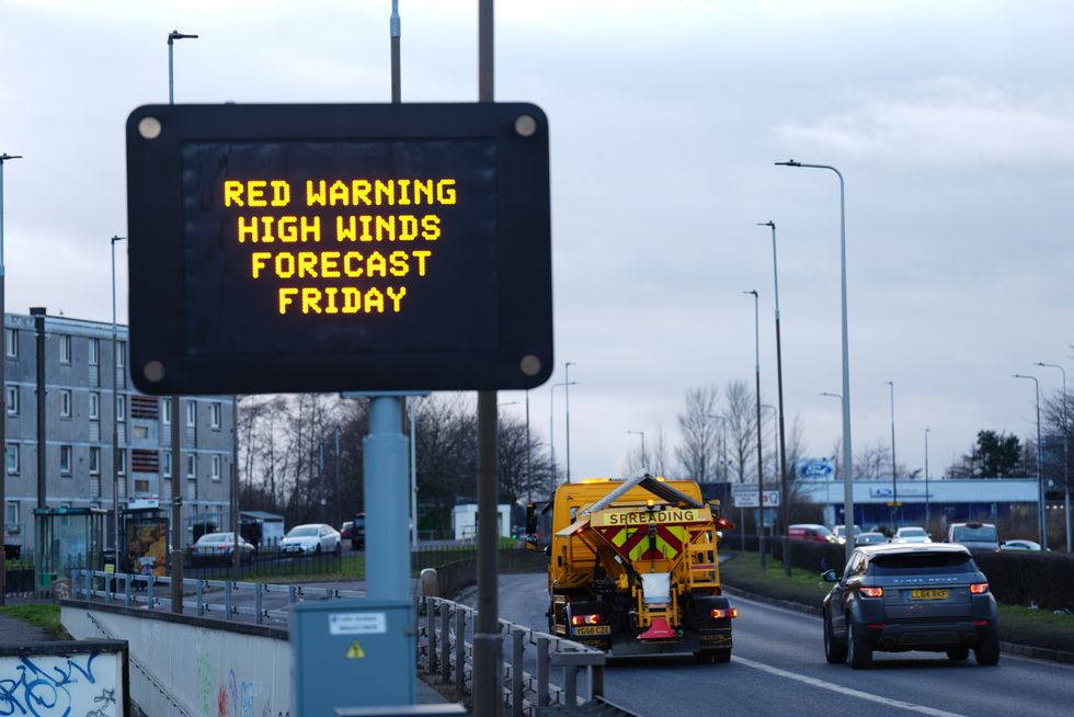 A road sign displaying a red weather warning for Friday on Calder Road, Edinburgh\u200b