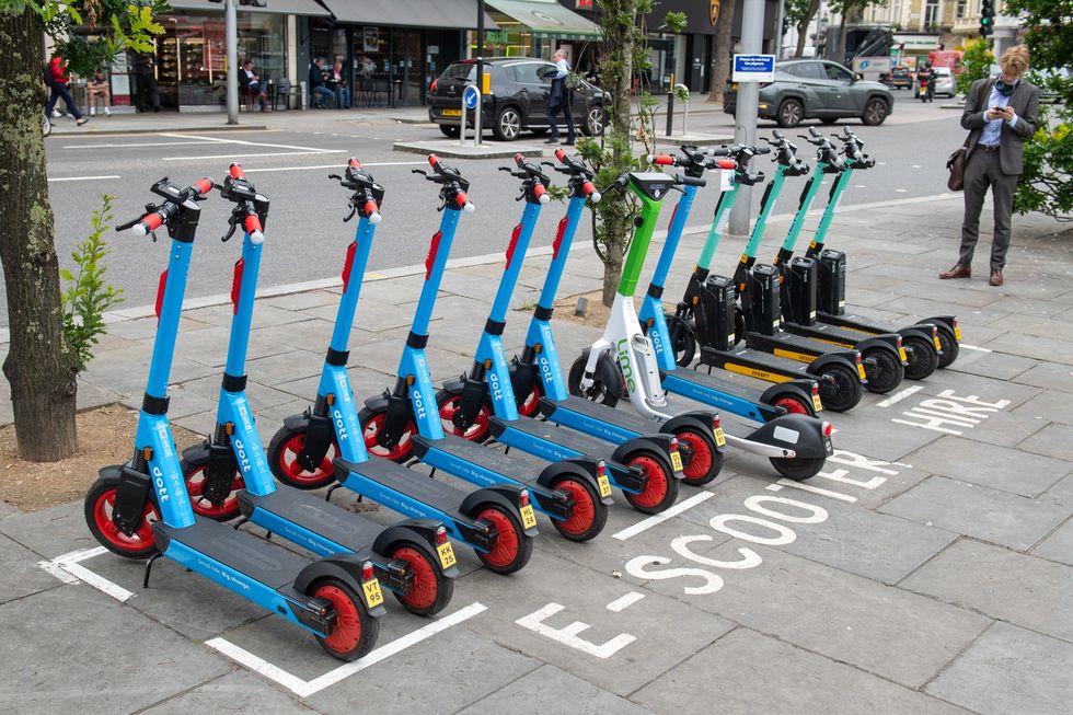 A row of e-scooters