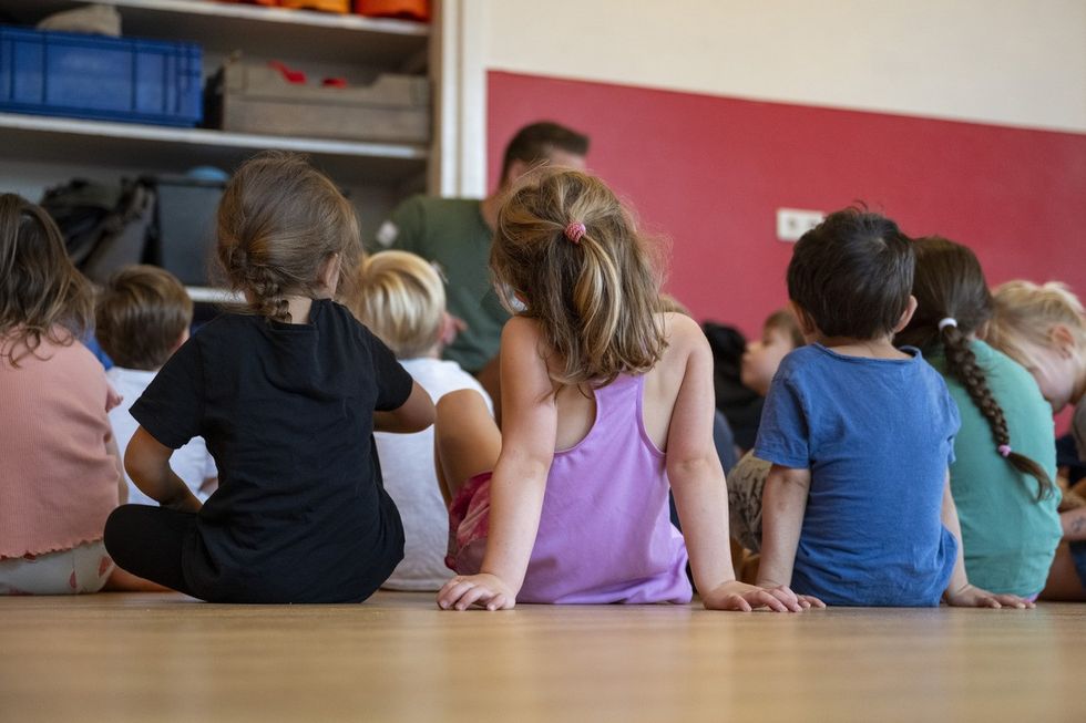 A stock image of a group of nursery children