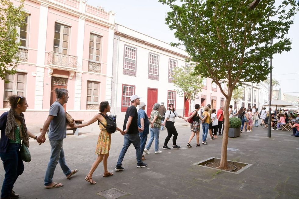 Activists hold a human chain protest