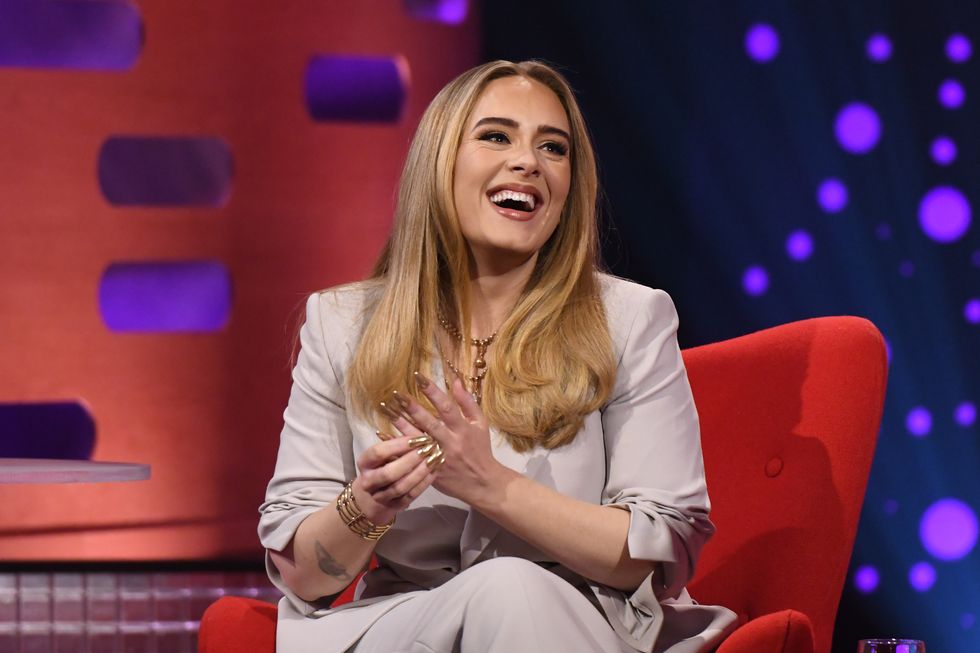 adele laughs on-stage with graham norton while filming the bbc chatshow