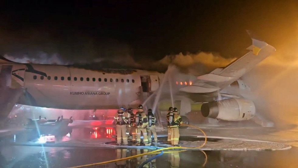 An Air Busan plane caught fire before take off at Gimhae International Airport in Busan