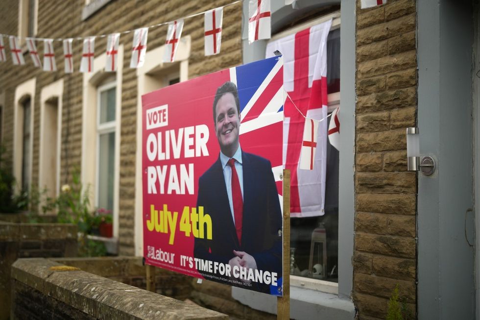 An election placard for Labour candidate Oliver Ryan stands outside a home on June 25, 2024 in Burnley, England