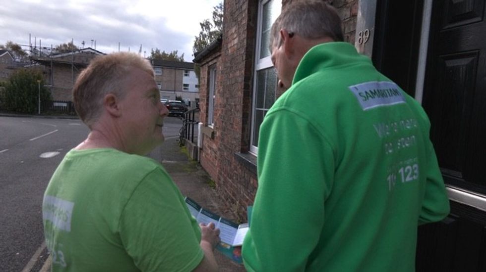 An image of charity workers from Samaritans