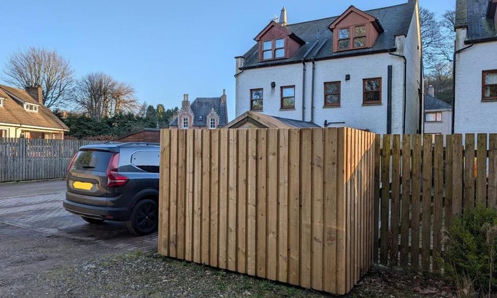 An image of the fence erected around the shed