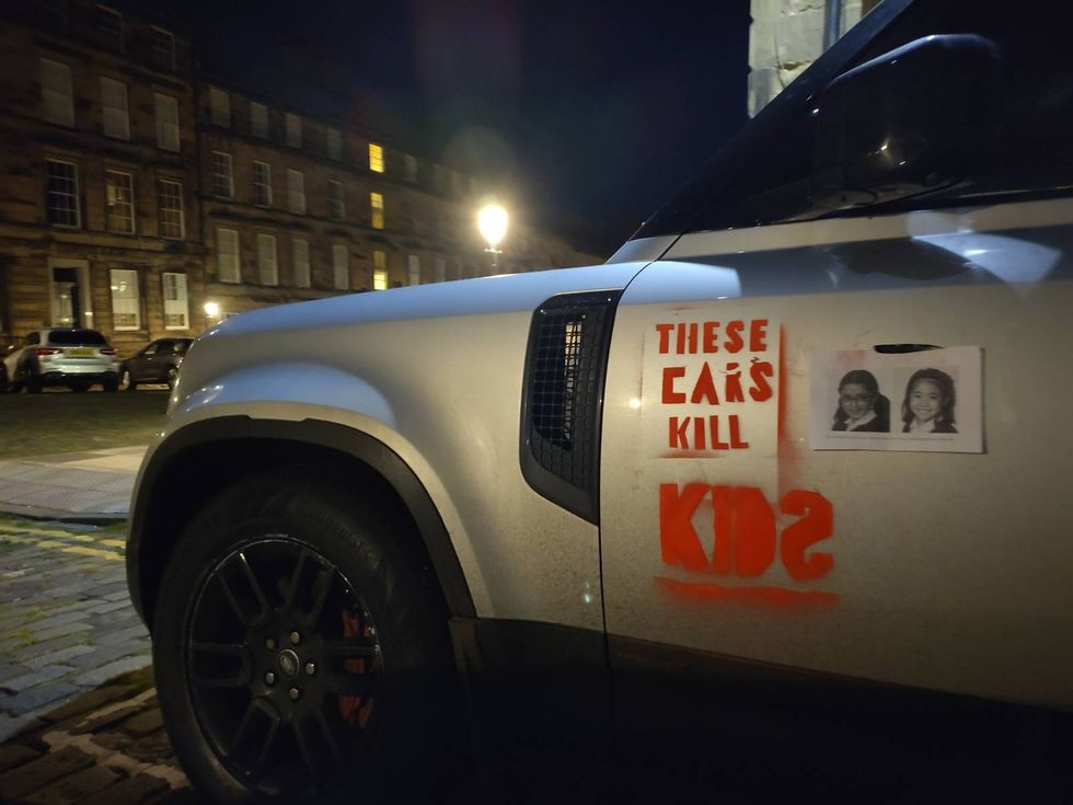 An SUV with 'These cars kill kids' sprayed on in Edinburgh