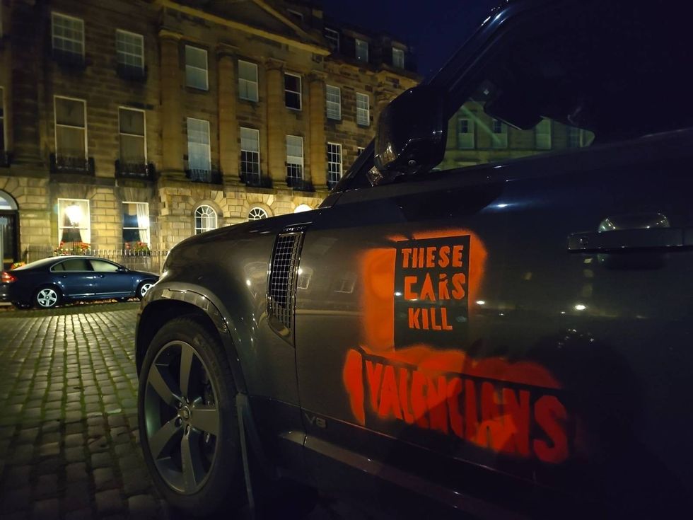 An SUV with 'These cars kill Valencians' sprayed on in Edinburgh