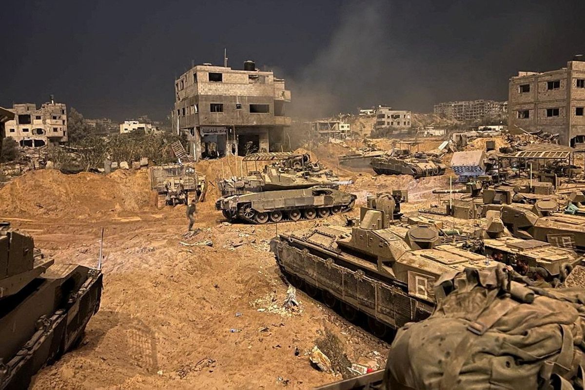 Armoured vehicles of the Israel Defense Forces (IDF) are seen during their ground operations at a location given as Gaza