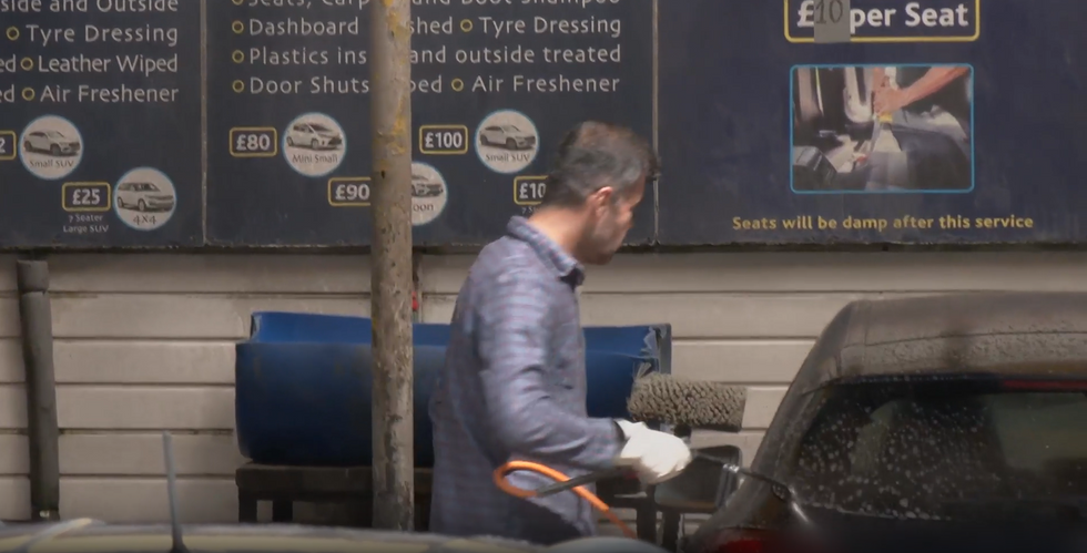 Asylum seeker working at carwash