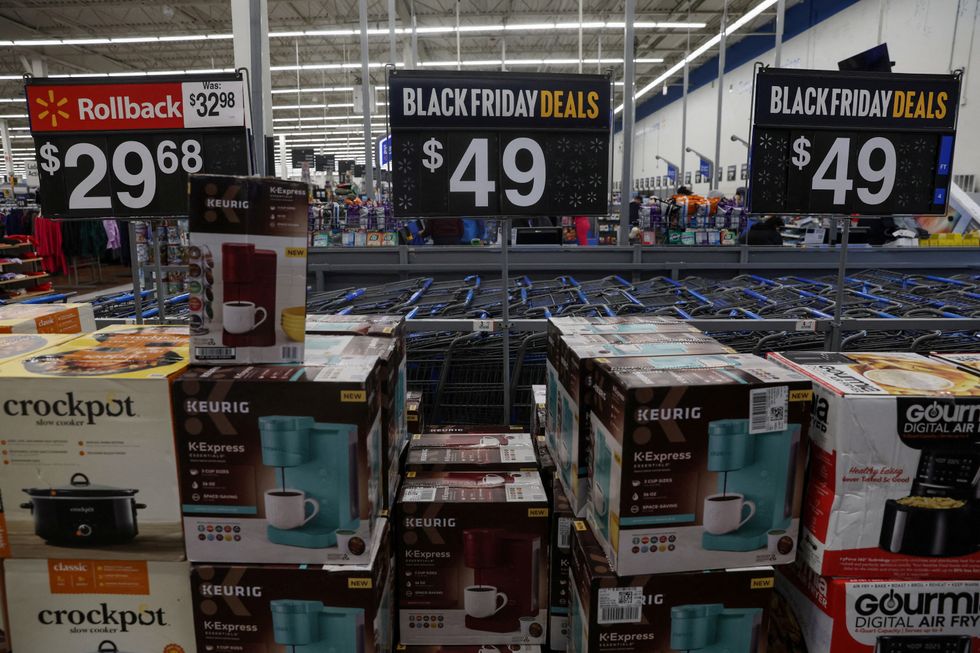 black friday deals and prices shown on shelves inside walmart store