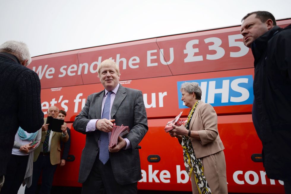 Boris Johnson speaks to Vote Leave campaigners as he boards the Vote Leave campaign bus in Truro, Cornwall