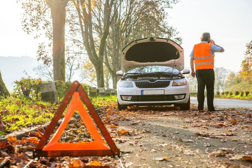 Broken down car on the side of the road