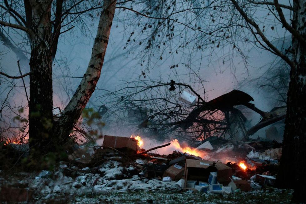 Burning goods following the crash of a cargo plane near the Vilnius International Airport in Vilnius