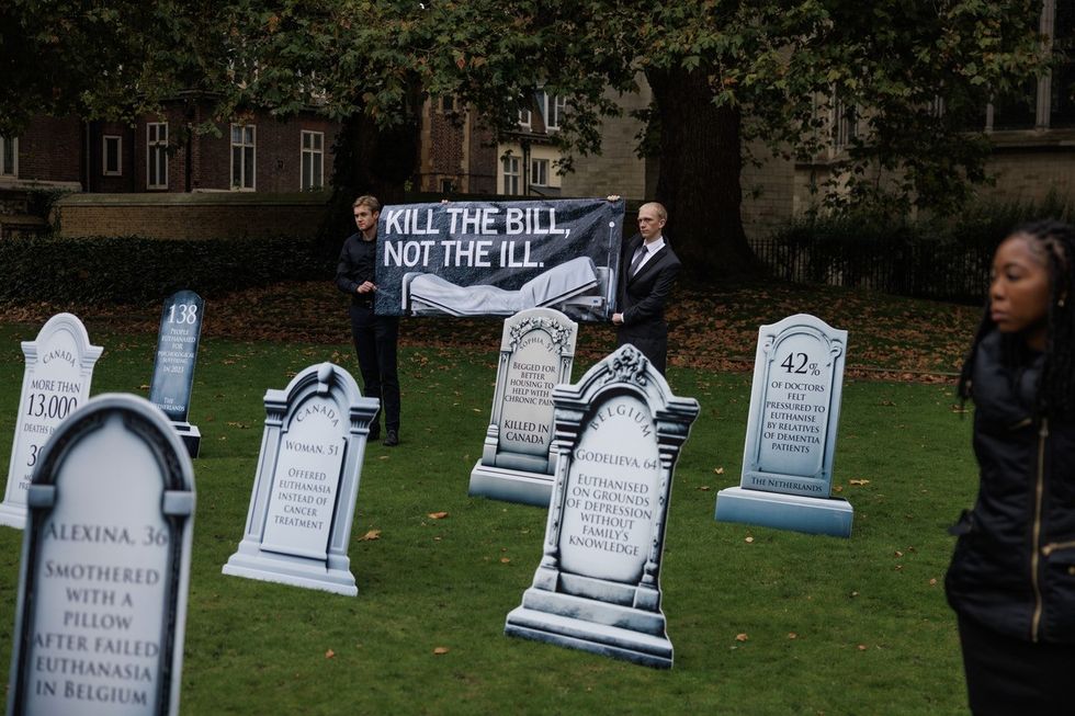 Campaigners near Parliament Square against the proposed bill to legalise assisted dying,