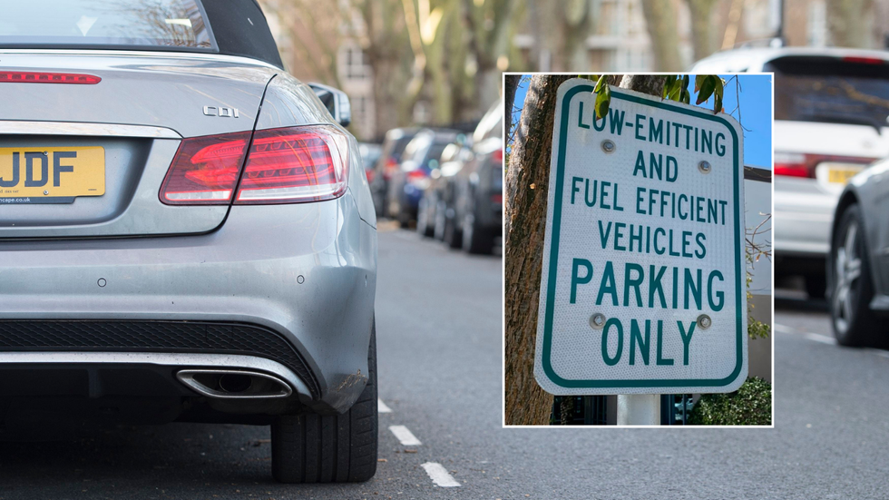 Cars parked and an emissions-based parking sign