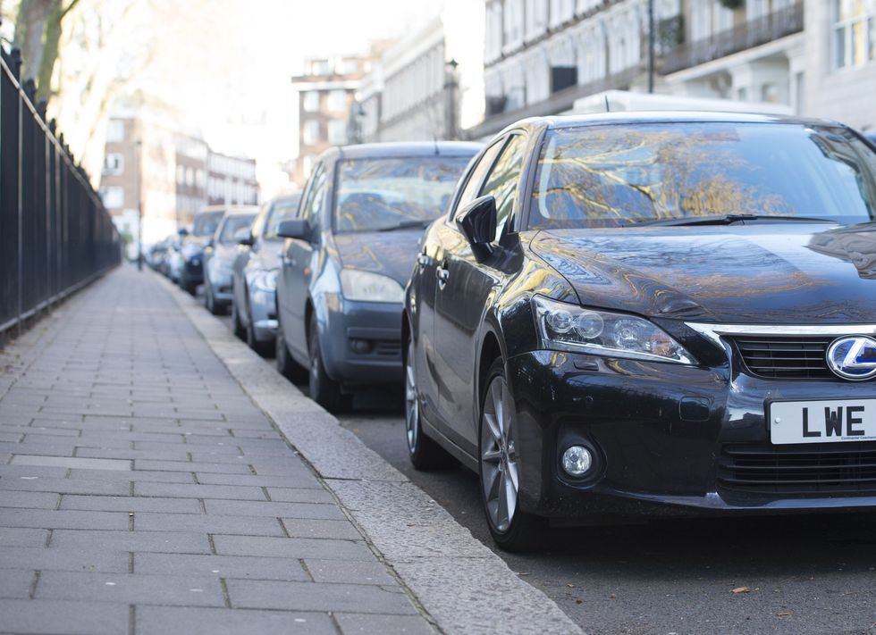 Cars parked on a street.