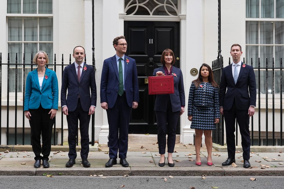 Chancellor of the Exchequer Rachel Reeves poses outside 11 Downing Street, London, with her ministerial red box and members of her Treasury team, before delivering her Budget in the Houses of Parliament