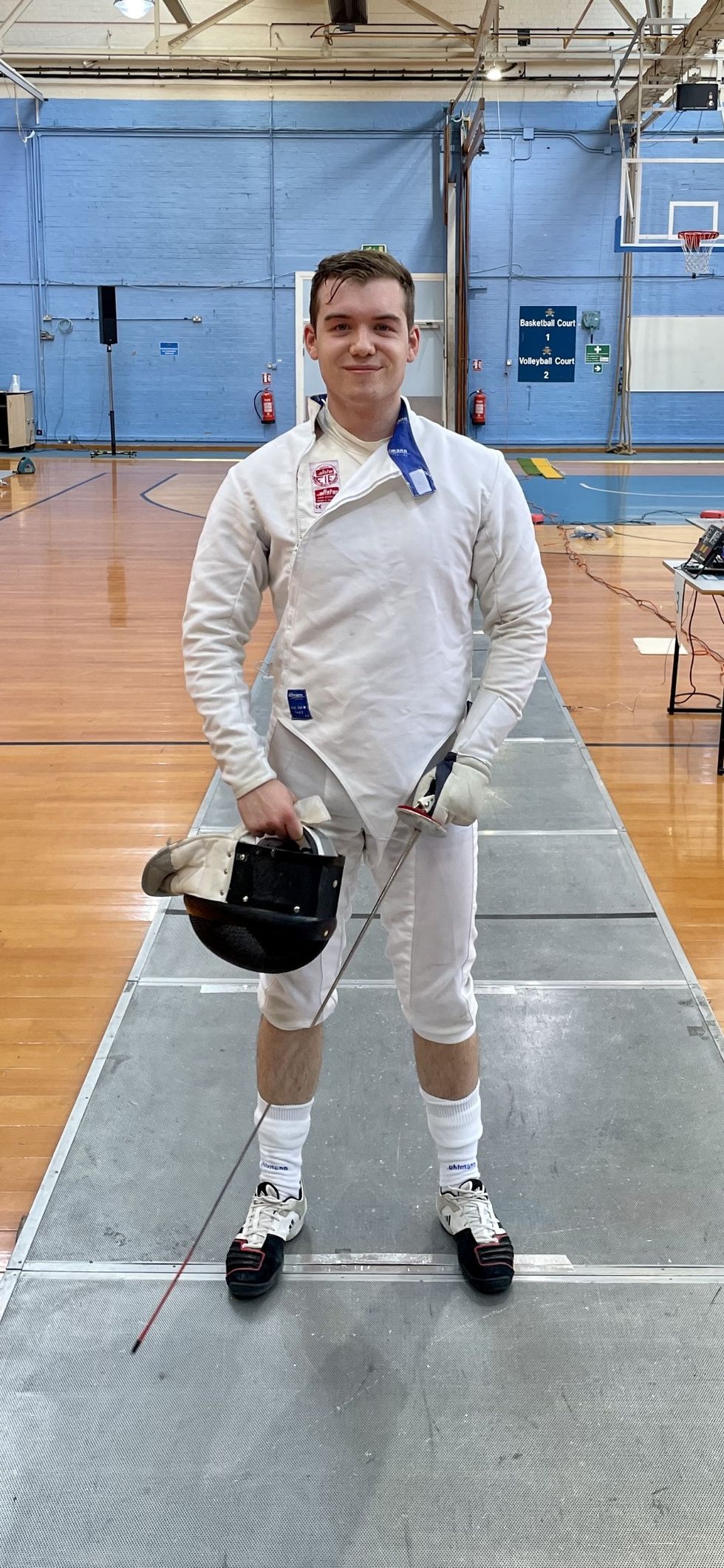 Charlie Peters in fencing kit