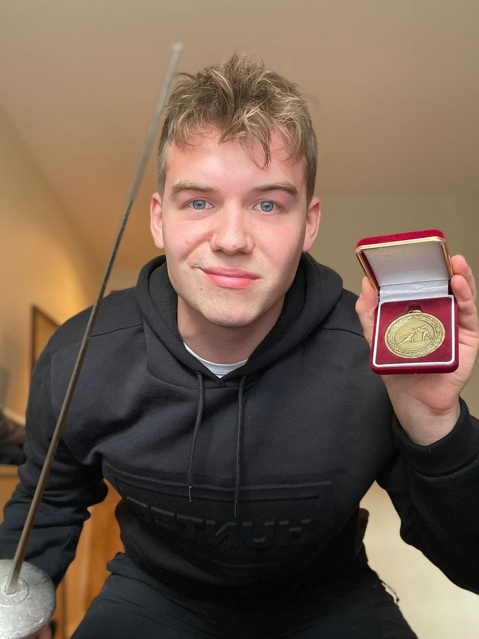 Charlie Peters with fencing medal