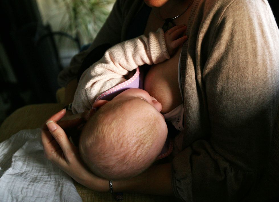 Child being breastfed