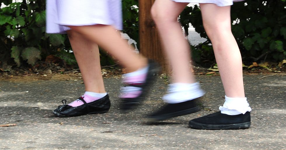 Children running, only legs visible