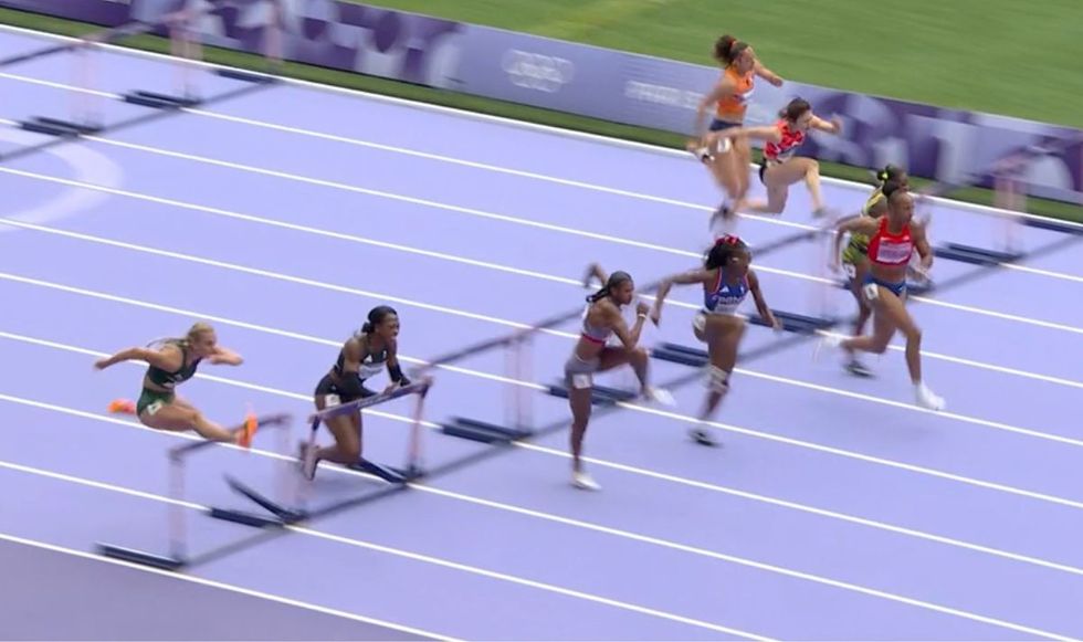 British female sprinter clatters chestfirst into hurdles in scary