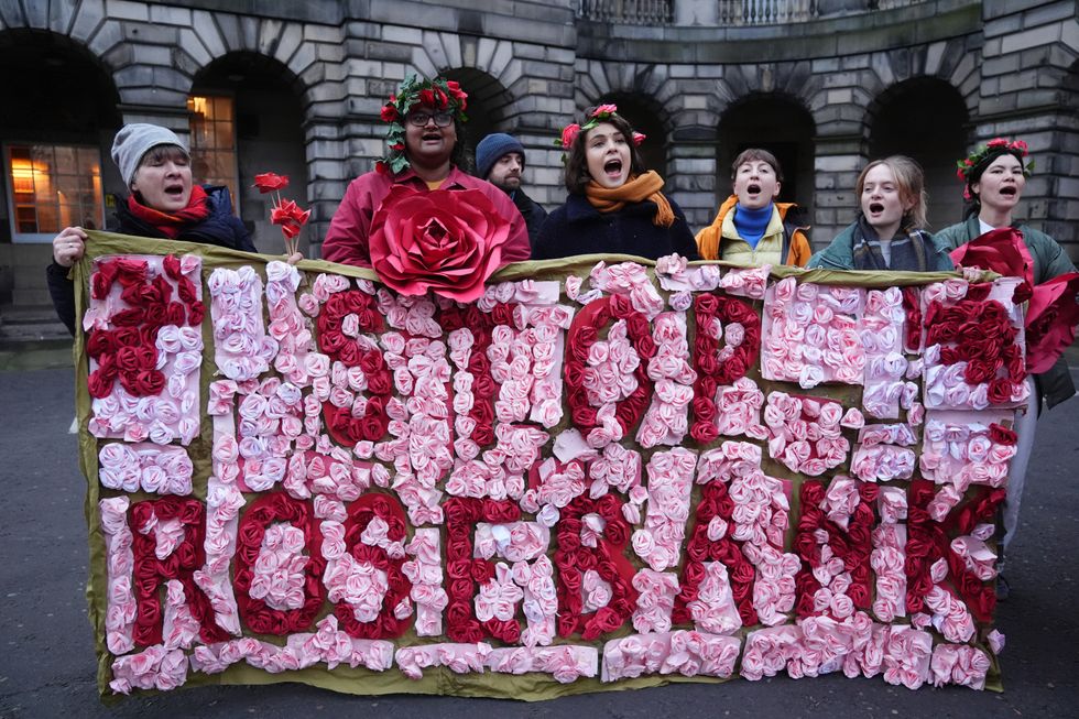 Climate activists from Greenpeace and Uplift during a demonstration outside the Scottish Court of Session, Edinburghu200b