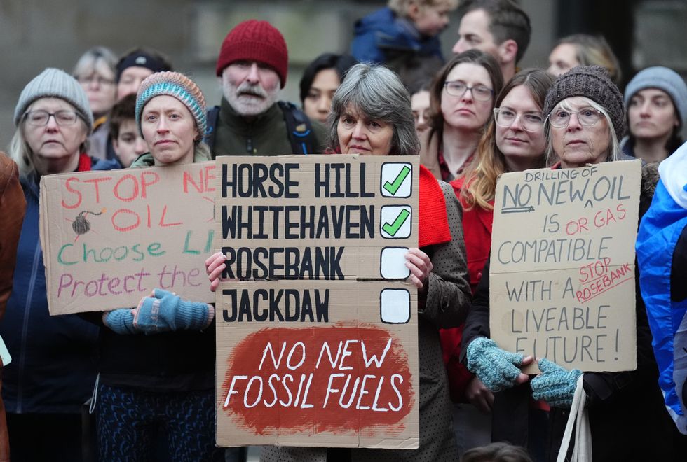 Climate activists from Greenpeace and Uplift during a demonstration outside the Scottish Court of Session, Edinburghu200b