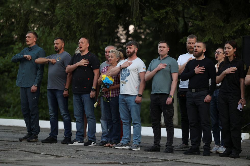 Commanders of defenders of the Azovstal Iron and Steel Works in Mariupol Denys Prokopenko, Sviatoslav Palamar, Denys Shleha, Serhii Volynskyi and Oleh Homenko sing a national anthem after their return from Istanbul, July 8, 2023