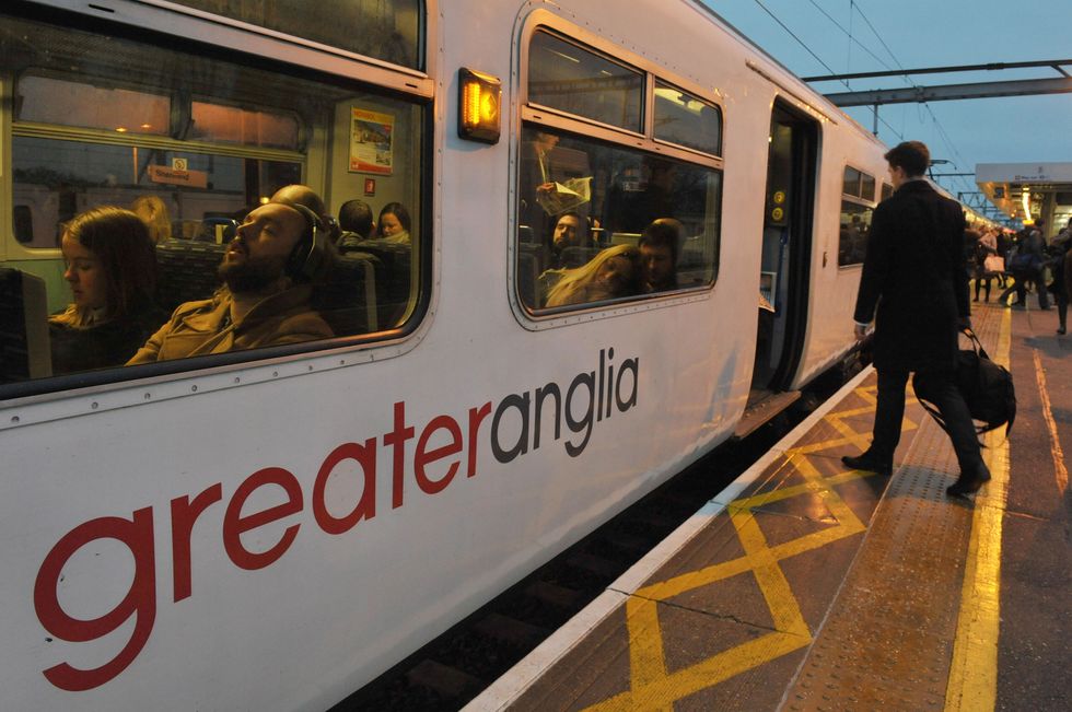 Commuters board a Greater Anglia train at Shenfield in Essex,