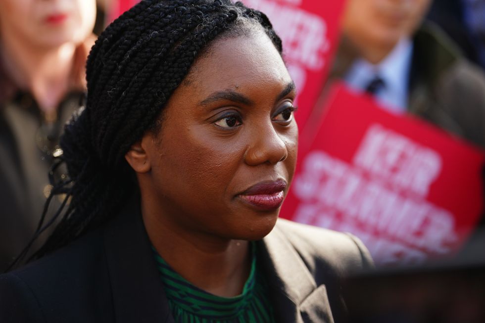 Conservative Party leader Kemi Badenoch speaking to a member of the media during a farmers protest in Whitehall