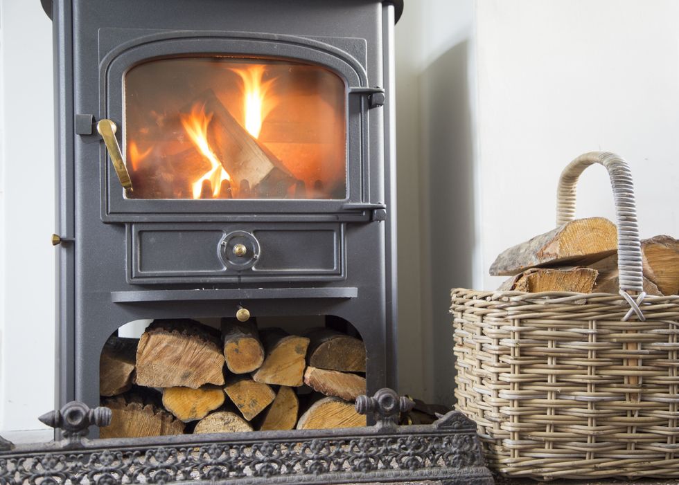 Council slaps household with u00a3175 fine for using wood burning stove which emits 'unreasonable and excessive smoke'