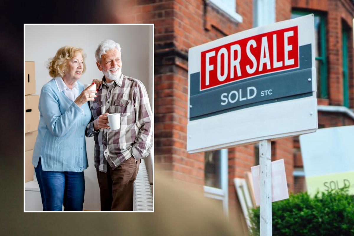 Couple moving house / for sale sign