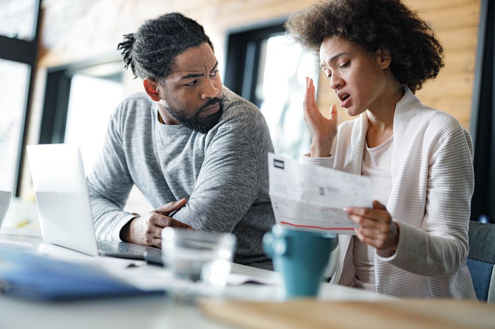 Couple worried at laptop